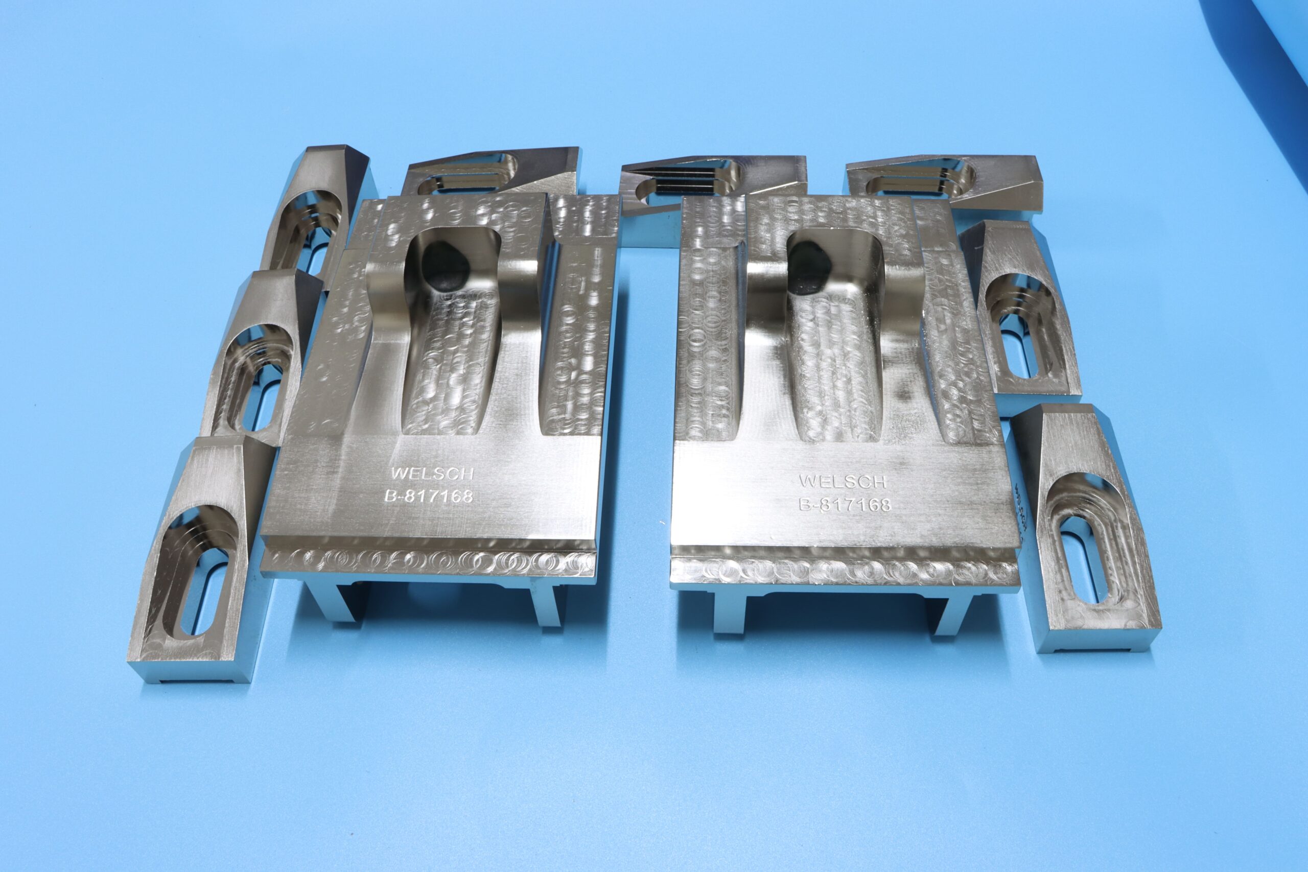 High-precision custom machined die mold steel blocks with laser engraved part numbers.