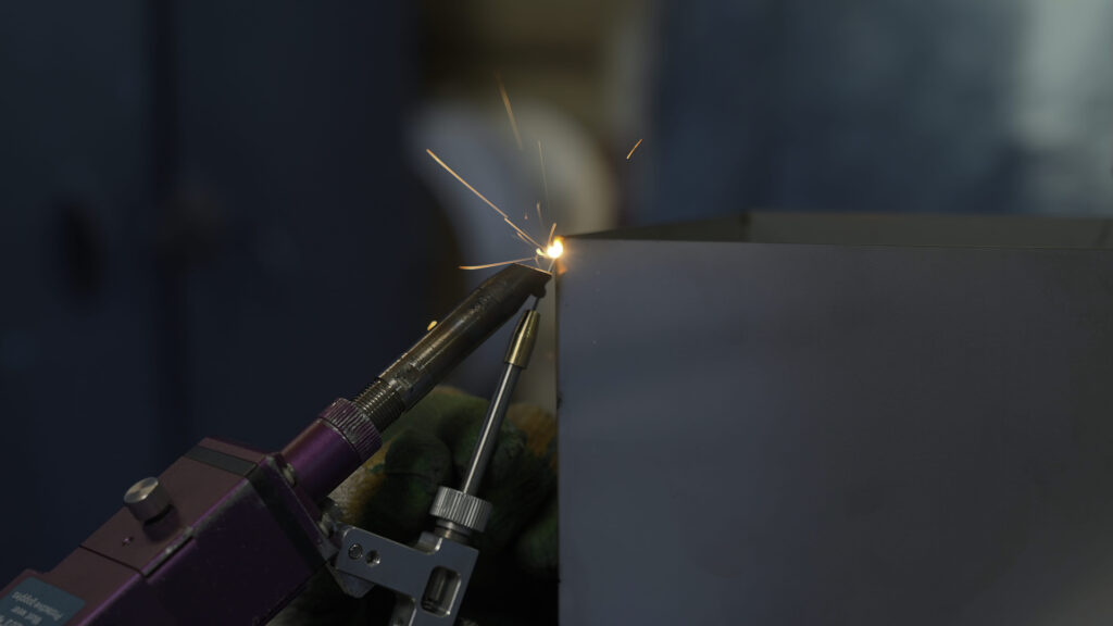 Metal Welder Working with Torch in Construction Setting